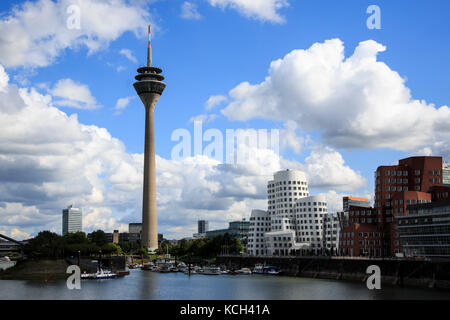 Rheinturm tower and the Gehry Building in Medienhafen, Media Harbour, Dusseldorf, Germany Stock Photo