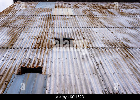 Looking up the exterior of a building clad in corrugated metal. Stock Photo