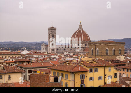 Terracotta roof tile dominate the skyline of Florence in Italy, with Il Duomo clearly in view Stock Photo