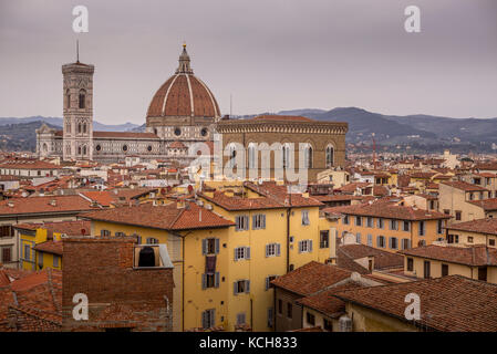 Terracotta roof tile dominate the skyline of Florence in Italy, with Il Duomo clearly in view Stock Photo