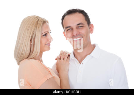 Portrait Of Loving Couple Embracing Isolated Over White Background Stock Photo