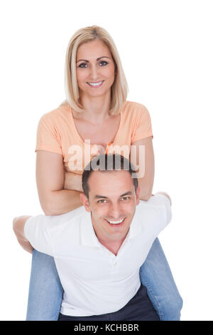 Attractive Man Piggybacking His Pretty Girlfriend Isolated Over White Background Stock Photo