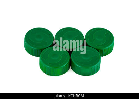 Five green plastic bottle caps isolated on white Stock Photo