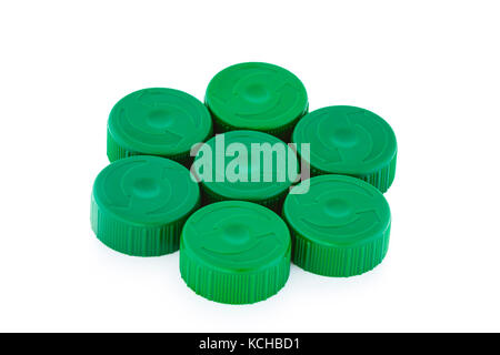 Five green plastic bottle caps isolated on white background Stock Photo