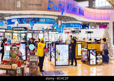 BANGKOK, THAILAND - JANUARY 13, 2017: Passengers at duty free shop in the Don Mueang airport. The airport is considered to be Asia oldest operating ai Stock Photo