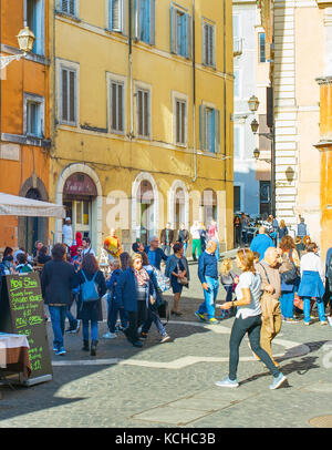 Someone Walking Rome ROME, ITALY - NOV 01, 2016: People walking on Old Town street of Rome ...