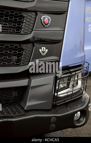 ORIPAA FINLAND - SEPTEMBER 30, 2017: Detail with Scania and V8 logos, headlamp protection and heavy duty bumper of the new Scania XT R650 logging truc Stock Photo