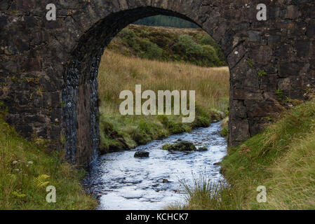 A view of the stream and through the fairy bridge on the Isle of Skye, Scotland Stock Photo