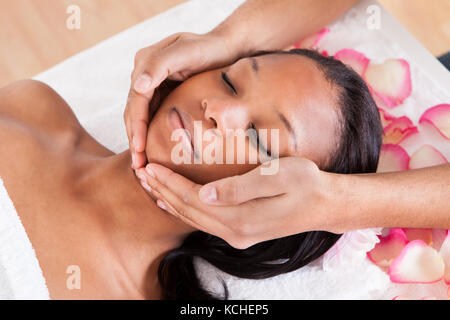 Portrait Of Woman Having A Massage In Spa Stock Photo