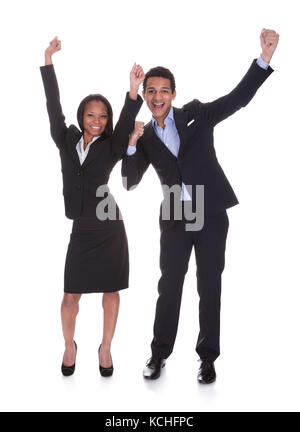 Portrait Cheering Young Business Couple Over White Background Stock Photo