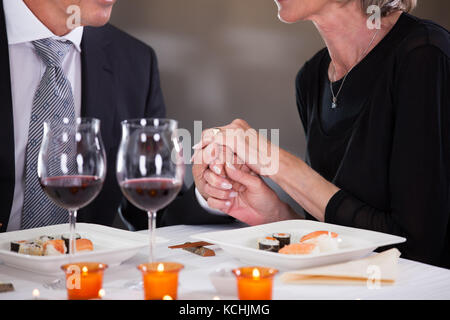 Romantic Couple Having Dinner At The Restaurant Stock Photo