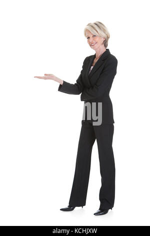 Portrait Of Happy Businesswoman Gesturing On White Background Stock Photo