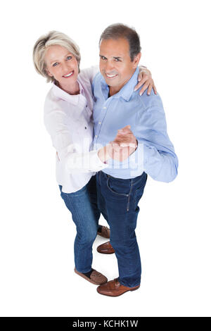 Happy Mature Couple Dancing Isolated Over White Background Stock Photo