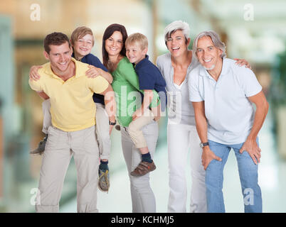 Portrait Of Happy Three Generations Family Standing Together Stock Photo