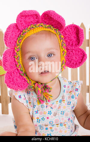 cute blond girl sittin playing Stock Photo - Alamy