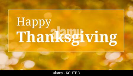 Digital composite of Happy thanksgiving text with warm yellow leaves Stock Photo