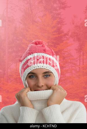 Digital composite of Woman in Autumn with hat and jumper in pink forest Stock Photo