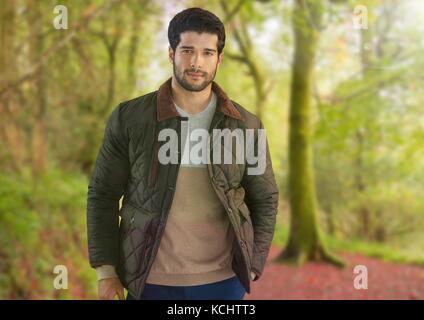 Digital composite of Man in Autumn with coat in forest Stock Photo