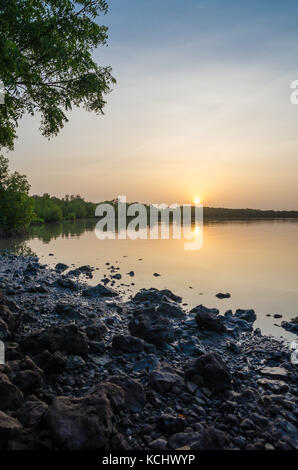Beautiful and peaceful sunset over calm Gambia river, The Gambia, West Africa Stock Photo