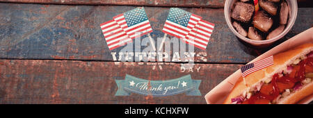 Logo for veterans day in america  against hot dog and cold drink on with 4th july theme Stock Photo