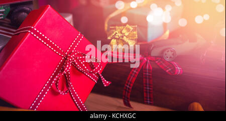 Wrapped gifts on wooden trolley during Christmas time Stock Photo