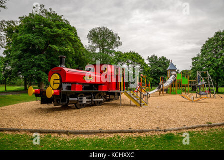 Large red train in Seaton park outdoor children playground, Aberdeen city, Scotland Stock Photo
