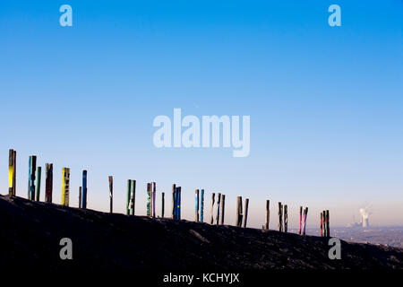 Germany, Ruhr area, Bottrop, heap Haniel, installation Totems by the Basque artist Agustin Ibarrola, artwork made of 100 cross-sills.  Deutschland, Ru Stock Photo