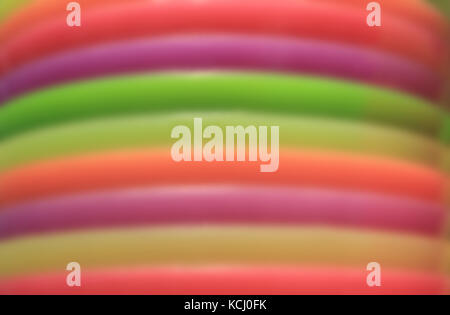 Abstract blurred photo of piled up colorful plates Stock Photo