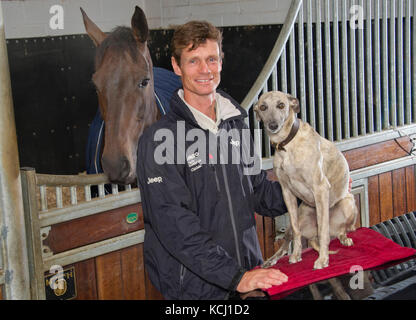 Equestrian William Fox-Pitt with his dog 'Poppy' Stock Photo