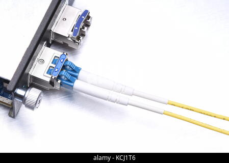 Gigabit interface converter type XFP with optical network cables on metal grey background with copy space Stock Photo