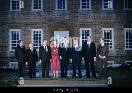 'Class photo' of the G-7 leaders from the Economic Summit in the rear garden of Carter's Grove in Williamsburg, Virginia on May 28, 1983.  From left to right: President Gaston Thorn of the European Commission, Prime Minister Amintore Fanfani of Italy, President Francois Mitterrand of France, Prime Minister Margaret Thatcher of the United Kingdom, United States President Ronald Reagan, Prime Minister Yasuhiro Nakasone of Japan, Chancellor Helmut Kohl of West Germany, and Prime Minister Pierre Trudeau of Canada. Credit: Arnie Sachs / CNP /MediaPunch Stock Photo