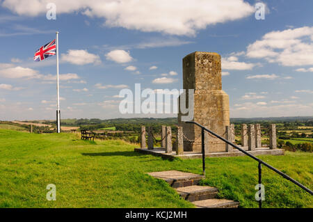 A Union Jack flying on Mere Castle, beside a memorial to the 43rd (Wessex) Infantry Division. Stock Photo