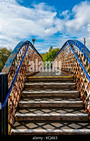 Rubberised steps painted to comply with health and safety guides display patterns as the strong autumn sun shines through the sides of the  handrails Stock Photo