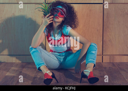 fashionable woman with plant in flowerpot Stock Photo