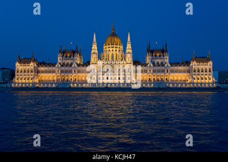 An evening nighttime view of the Hungarian Parliment Building on the Danube river in Budapest. Stock Photo