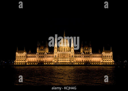 An evening nighttime view of the Hungarian Parliment Building on the Danube river in Budapest. Stock Photo