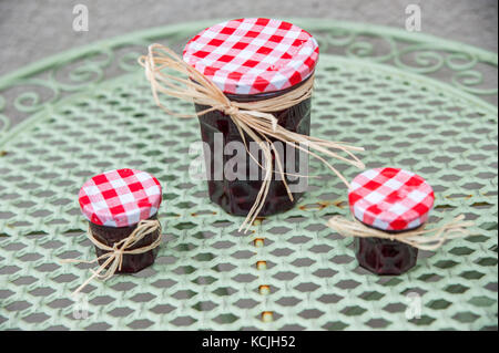 Homemade sloe jams on the rustic table Stock Photo