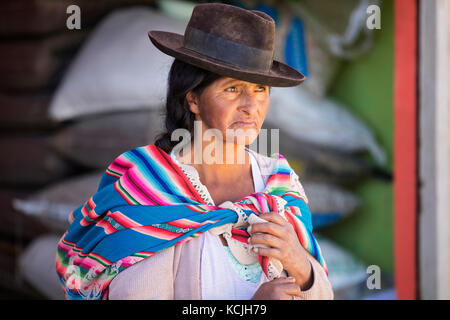 Elderly cholita, Bolivian woman with hat and long black hair braid in the town Tarabuco, Chuquisaca, Yamparáez Province, Bolivia Stock Photo
