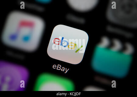 A close-up shot of the company logo representing the ebay app icon, as seen on the screen of a smart phone (Editorial use only) Stock Photo