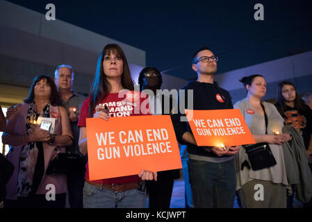 Las Vegas, USA. 05th Oct, 2017. On Oct. 5, 2017, at the East Las Vegas Community Center, Lisa Bailey, third from left, and other attendees listen as Nev. Sen. Pat Spearman, D-North Las Vegas, speaks during a vigil to commemorate the victims of the Route 91 Harvest Country Music Festival mass shooting. Credit: Jason Ogulnik/Alamy Live News Stock Photo