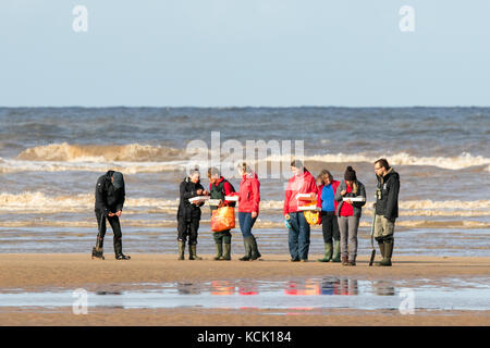 Southport, Merseyside, Sunny in Southport. 6th October 2017. UK Weather.  Marine biology students examine the sea life as some lovely warm autumn sunshine beams down on to the golden sands of Southport beach in Merseyside.  Credit: Cernan Elias/Alamy Live News Stock Photo