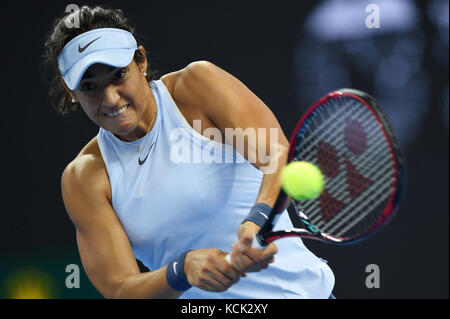 Beijing, China. 6th Oct, 2017. Caroline Garcia of France hits a return during the women's singles quarter-final match against Elina Svitolina of Ukraine at the China Open tennis tournament in Beijing on Oct. 6, 2017. Credit: Ju Huanzong/Xinhua/Alamy Live News Stock Photo