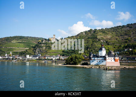 The town of Kaub on the river Rhine in Germany with castle Pfalz in the foreground Stock Photo