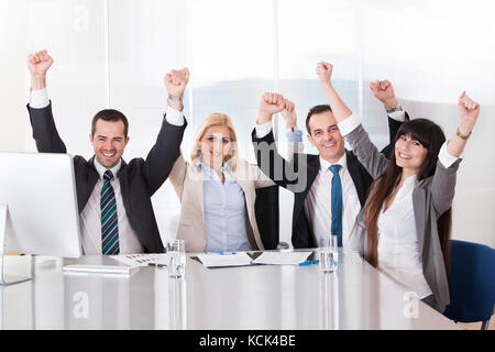 Happy Business Team In Office Celebrating Success Stock Photo