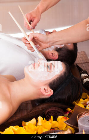 Close-up Of Couple With Face Mask In Spa Centre Stock Photo