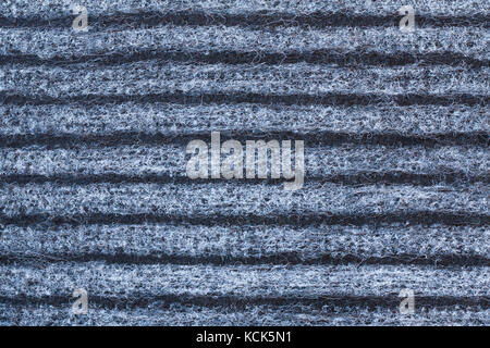 Background And Texture Of Striped Woolen Carpet Of Black, Gray And White Colors. Close Up. Stock Photo