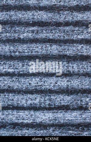 Background And Texture Of Striped Woolen Carpet Of Black, Gray And White Colors. Close Up. Stock Photo