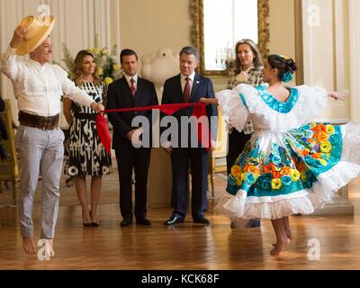 Traditional Colombian dancers perform the Cumbia dance for Mexican President Enrique Pena Nieto (left) and Colombian President Juan Manuel Santos at the Narino Presidential Palace October 27, 2016 in Bogota, Colombia.  (photo by Mexican Presidency Photo  via Planetpix) Stock Photo