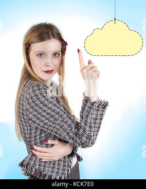 Young woman in business jacket showing yellow cloud that can be used for copy space Stock Photo