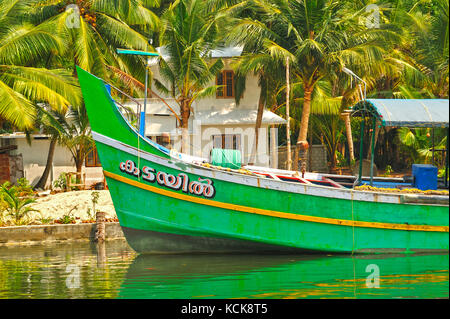 moored fishing boat in backwaters between Kollam and Cochin, Kerala, India Stock Photo